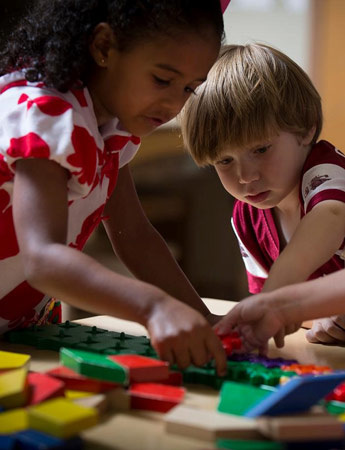 Children working with blocks at the Children's Center