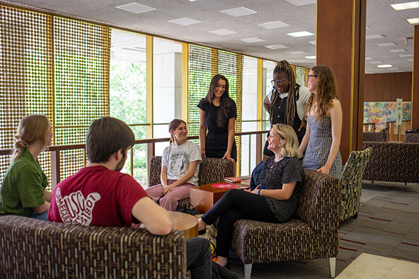students gathering in the library