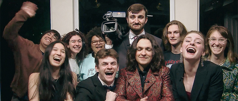 Group of students smiling and laughing.
