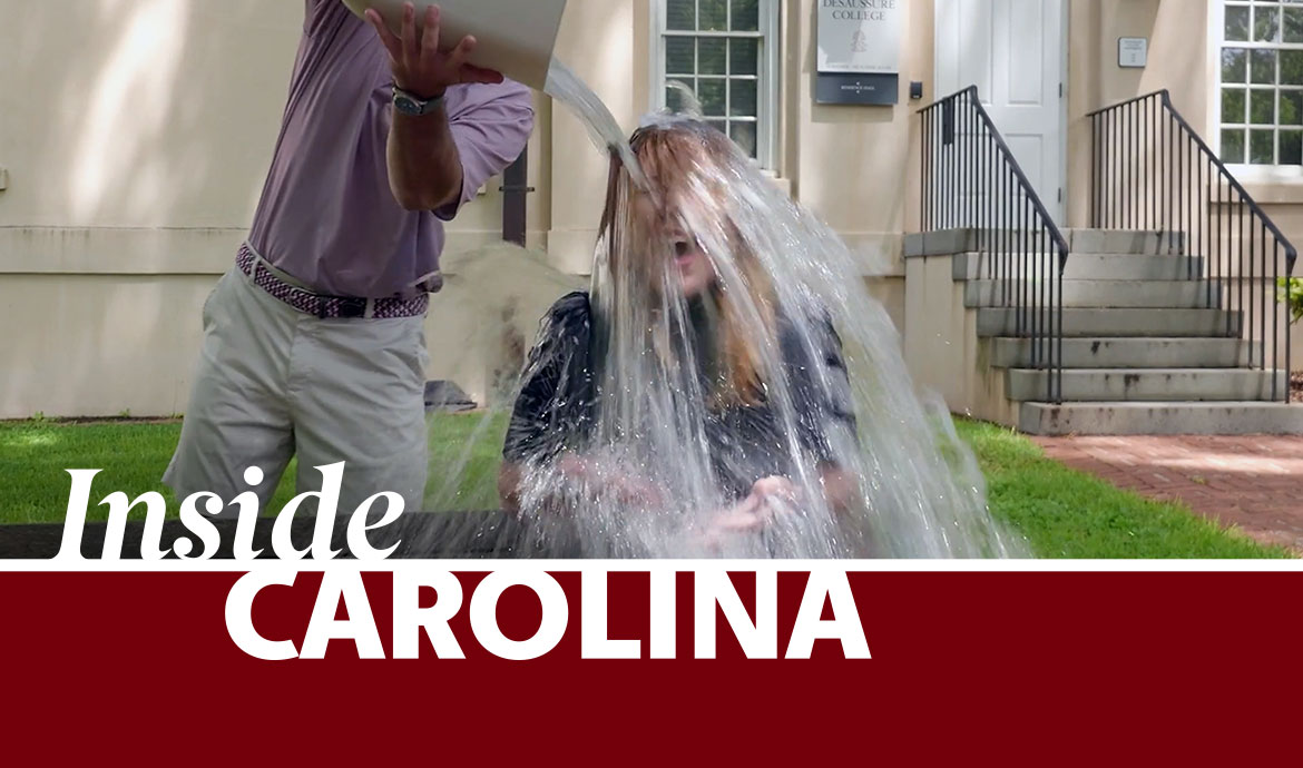 graphic that has a frame with the words Inside Carolina over an image of two people outside with one pouring water over the other's head