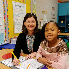 Teacher in clasroom with student