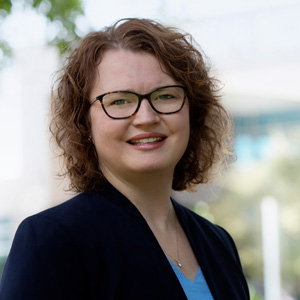 Amy Carter smiles in front of Chapin High School