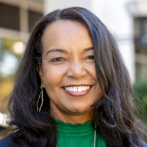 A portrait of Hope Rivers standing in front of Piedmont Technical College.