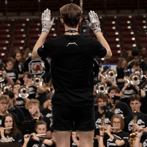 The drum major leads the Carolina bnad as it records the Metallica song for EA Sports.